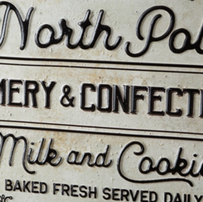 north pole creamery metal sign